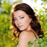 Bright-skinned woman with glowing skin after facial