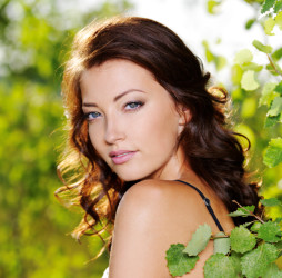 Bright-skinned woman with glowing skin after facial