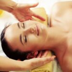 Relaxed woman smiling during massage